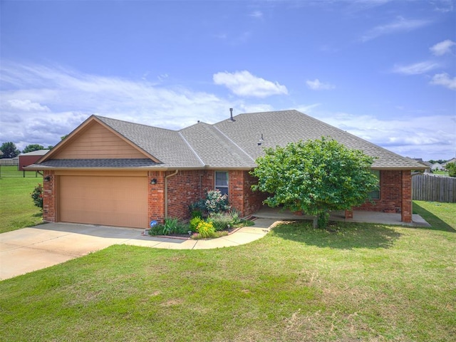 1861 Debbie Dr, Guthrie, OK 73044 - view of front of home with a garage, brick siding, concrete driveway, and roof with shingles