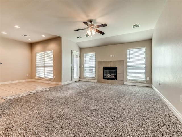 1861 Debbie Dr, Guthrie, OK 73044 - unfurnished living room with carpet flooring, a ceiling fan, recessed lighting, a tile fireplace, and baseboards