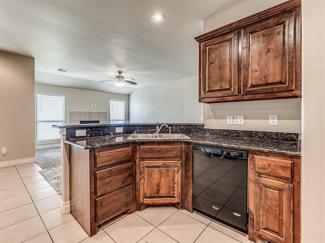 1861 Debbie Dr, Guthrie, OK 73044 - kitchen featuring black dishwasher, a sink, a ceiling fan, light tile patterned floors, and a peninsula