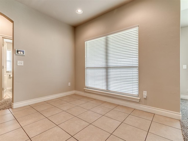1861 Debbie Dr, Guthrie, OK 73044 - unfurnished room with light tile patterned floors, plenty of natural light, arched walkways, baseboards, and recessed lighting