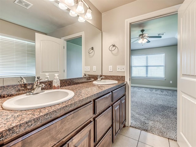 1861 Debbie Dr, Guthrie, OK 73044 - bathroom with double vanity, ceiling fan, and tile patterned floors