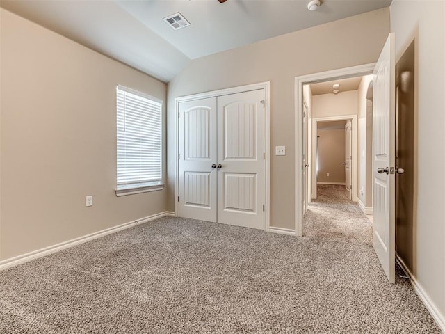 1861 Debbie Dr, Guthrie, OK 73044 - unfurnished bedroom with carpet floors, a closet, lofted ceiling, and baseboards