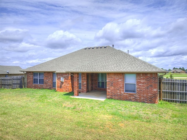 1861 Debbie Dr, Guthrie, OK 73044 - back of house featuring a patio area, a shingled roof, and brick siding