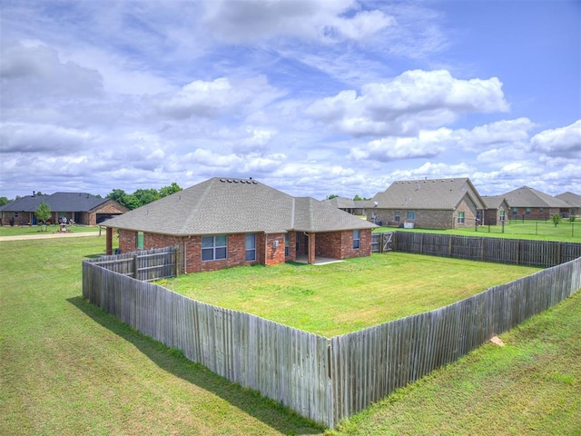 1861 Debbie Dr, Guthrie, OK 73044 - back of property with brick siding, roof with shingles, and a residential view