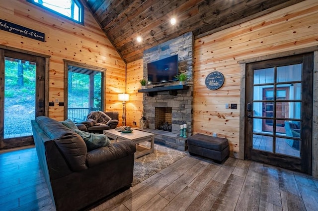 193 Pine Forest Trl, Broken Bow, OK 74728 - living room featuring wooden ceiling, high vaulted ceiling, wood-type flooring, wood walls, and a fireplace