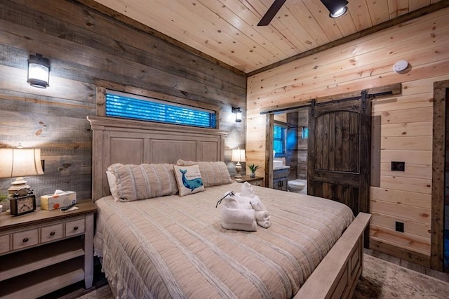 193 Pine Forest Trl, Broken Bow, OK 74728 - bedroom with a barn door, wooden walls, wood ceiling, and ceiling fan