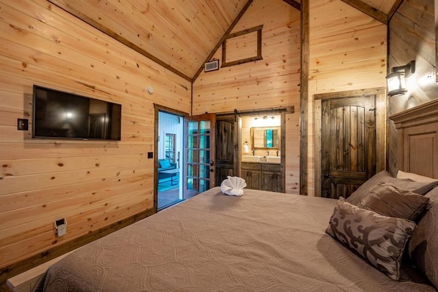 193 Pine Forest Trl, Broken Bow, OK 74728 - bedroom featuring wood walls, wood ceiling, a barn door, access to exterior, and high vaulted ceiling