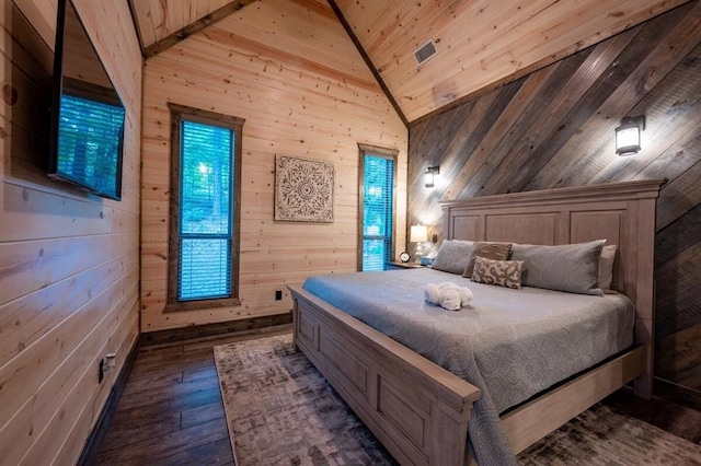 193 Pine Forest Trl, Broken Bow, OK 74728 - bedroom with lofted ceiling, wooden walls, and dark wood finished floors