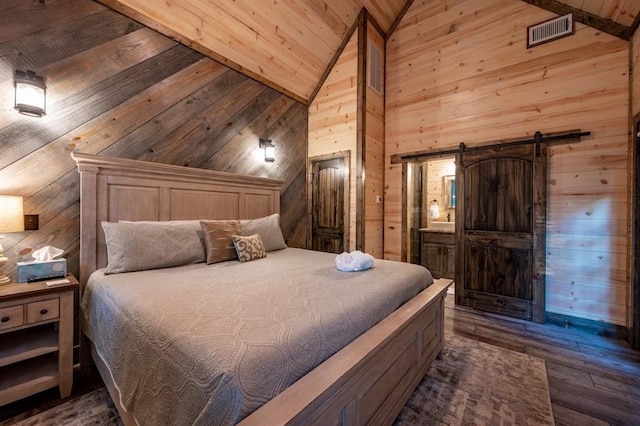 193 Pine Forest Trl, Broken Bow, OK 74728 - bedroom featuring wooden walls, dark wood-style floors, high vaulted ceiling, wood ceiling, and a barn door