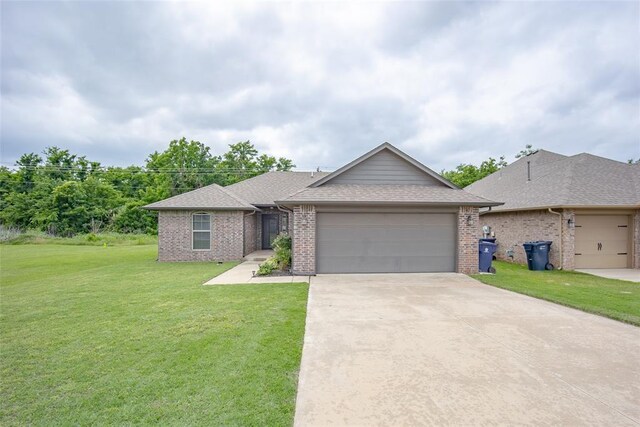 7521 Prairie Twyne Dr, Yukon, OK 73099 - ranch-style home featuring an attached garage, a front lawn, concrete driveway, brick siding, and a shingled roof