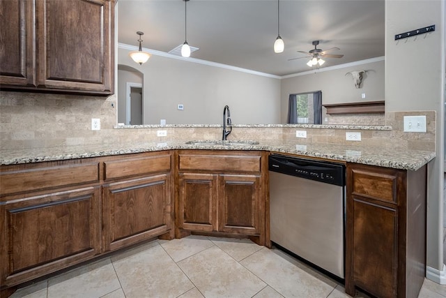 7521 Prairie Twyne Dr, Yukon, OK 73099 - kitchen featuring stainless steel dishwasher, a sink, crown molding, tasteful backsplash, and a ceiling fan
