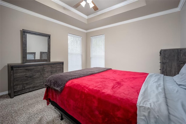 7521 Prairie Twyne Dr, Yukon, OK 73099 - carpeted bedroom with a raised ceiling, ornamental molding, a ceiling fan, and baseboards