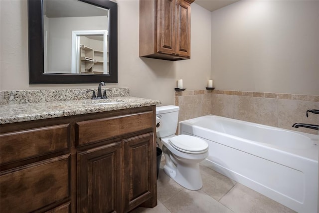 7521 Prairie Twyne Dr, Yukon, OK 73099 - full bathroom with a bath, toilet, vanity, and tile patterned flooring