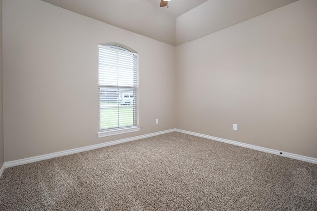 7521 Prairie Twyne Dr, Yukon, OK 73099 - empty room with carpet, healthy amount of natural light, baseboards, ceiling fan, and vaulted ceiling