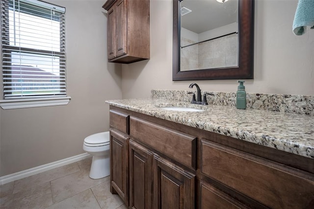 7521 Prairie Twyne Dr, Yukon, OK 73099 - bathroom with vanity, toilet, baseboards, and healthy amount of natural light