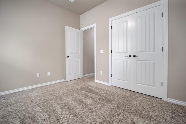 7521 Prairie Twyne Dr, Yukon, OK 73099 - unfurnished bedroom featuring carpet, a closet, and baseboards