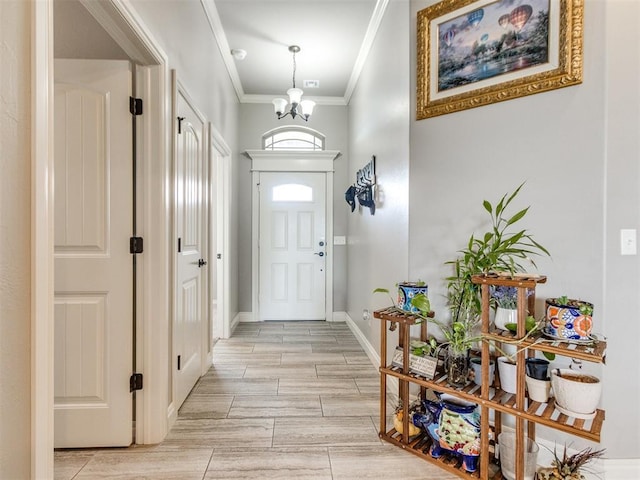 11728 SW 15th Ter, Yukon, OK 73099 - foyer entrance with ornamental molding, a chandelier, and baseboards