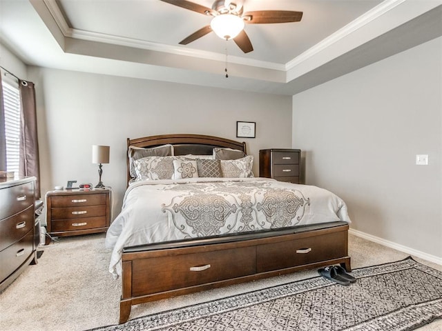 11728 SW 15th Ter, Yukon, OK 73099 - carpeted bedroom with ornamental molding, a raised ceiling, baseboards, and ceiling fan