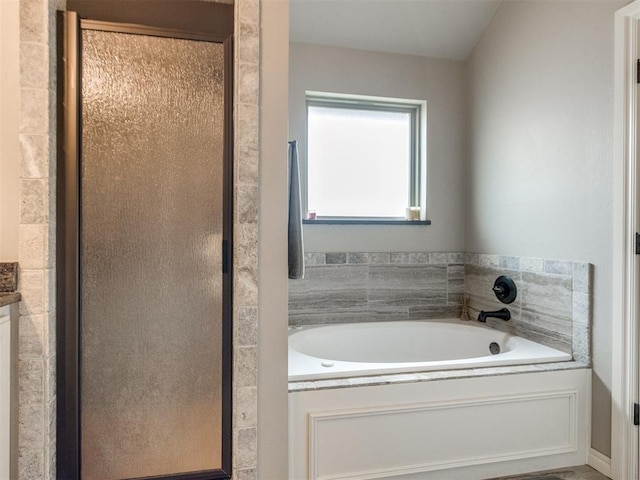 11728 SW 15th Ter, Yukon, OK 73099 - bathroom featuring a bath and a shower stall