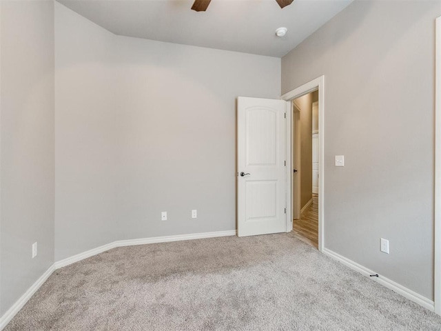 11728 SW 15th Ter, Yukon, OK 73099 - carpeted empty room with ceiling fan, baseboards, and a smoke detector