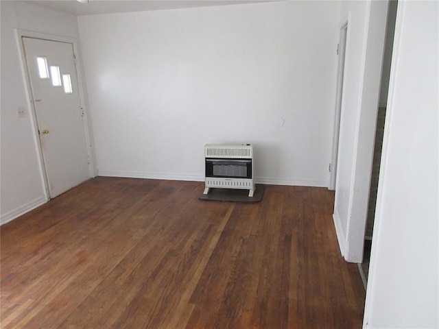 608 W Walnut St, Tecumseh, OK 74873 - foyer entrance featuring heating unit, wood finished floors, and baseboards