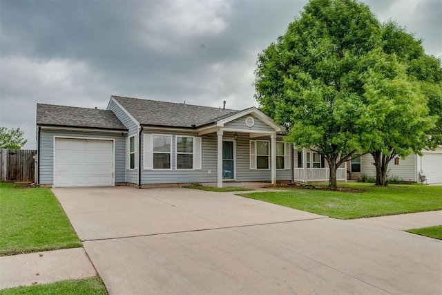 1705 NW 147th St, Edmond, OK 73013 - single story home featuring a garage, concrete driveway, covered porch, and roof with shingles