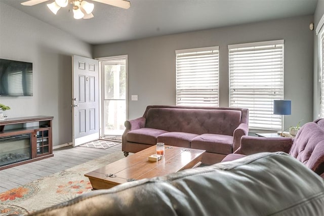1705 NW 147th St, Edmond, OK 73013 - living area with ceiling fan, wood finished floors, plenty of natural light, and baseboards