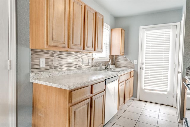 1705 NW 147th St, Edmond, OK 73013 - kitchen with stainless steel dishwasher, a sink, light brown cabinetry, light countertops, and light tile patterned floors