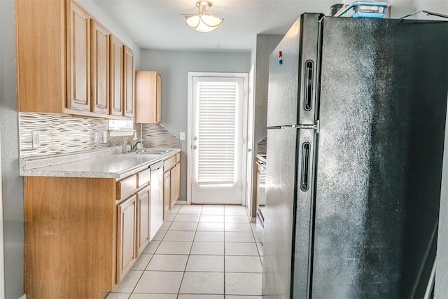 1705 NW 147th St, Edmond, OK 73013 - kitchen with freestanding refrigerator, light tile patterned floors, a sink, light countertops, and dishwasher