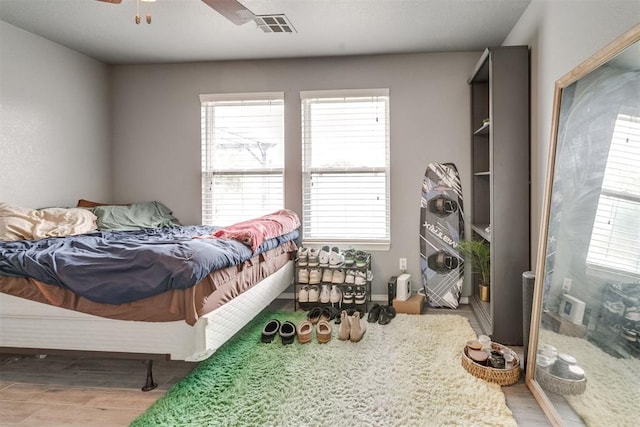 1705 NW 147th St, Edmond, OK 73013 - bedroom with wood finished floors and ceiling fan