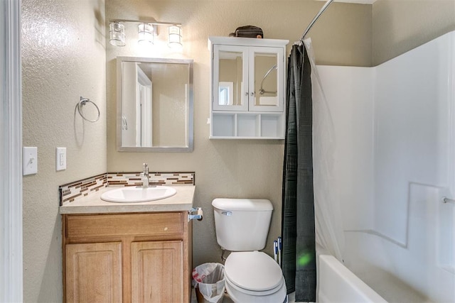 1705 NW 147th St, Edmond, OK 73013 - bathroom featuring vanity, shower / bath combination with curtain, toilet, tasteful backsplash, and a textured wall