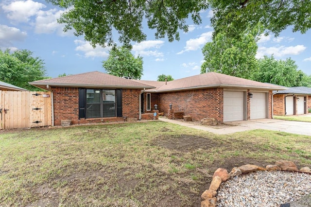 2232 Butternut Pl, Edmond, OK 73013 - single story home with a garage, driveway, brick siding, and roof with shingles