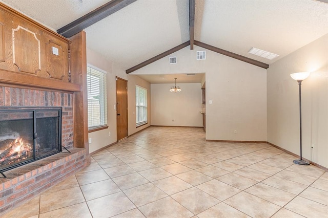 2232 Butternut Pl, Edmond, OK 73013 - unfurnished living room with a brick fireplace, light tile patterned flooring, a chandelier, a textured ceiling, and baseboards