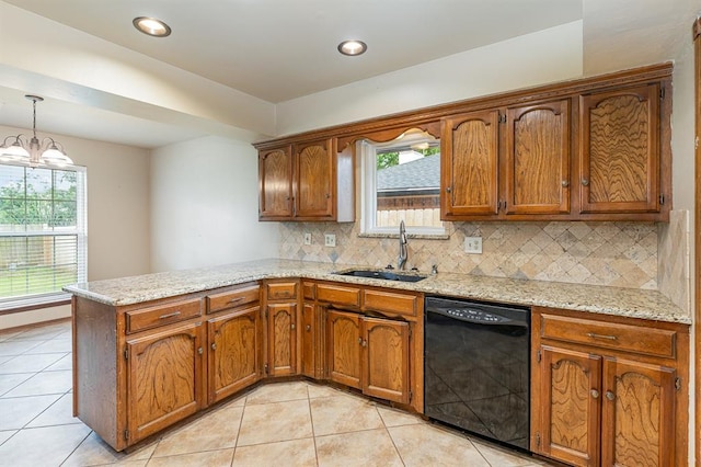 2232 Butternut Pl, Edmond, OK 73013 - kitchen featuring dishwasher, a sink, a peninsula, light tile patterned floors, and brown cabinets
