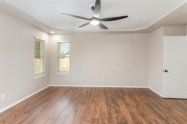 2232 Butternut Pl, Edmond, OK 73013 - spare room featuring wood finished floors, a ceiling fan, and baseboards