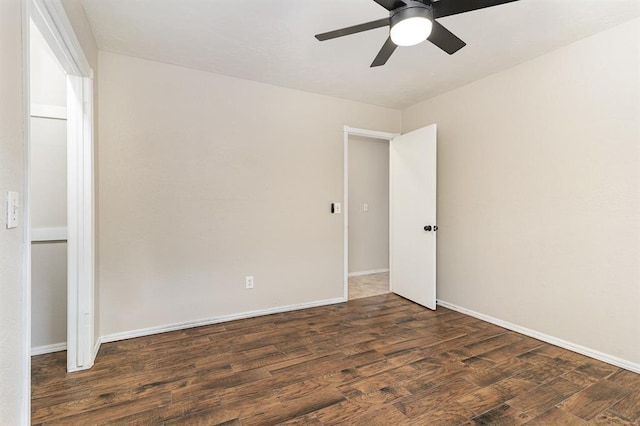 2232 Butternut Pl, Edmond, OK 73013 - empty room with ceiling fan, wood finished floors, and baseboards