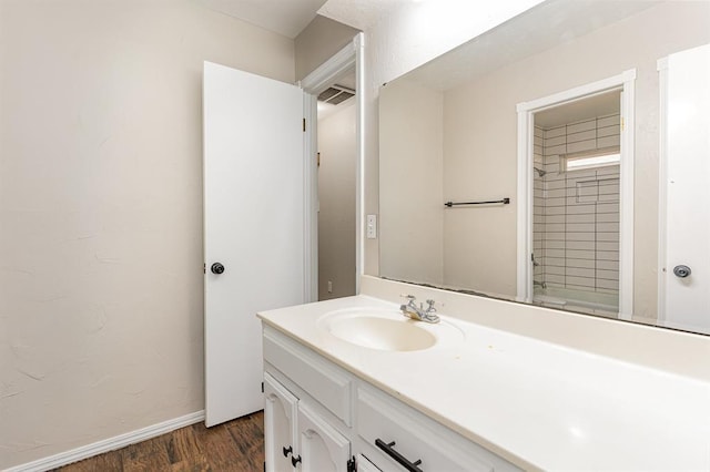 2232 Butternut Pl, Edmond, OK 73013 - bathroom featuring vanity, wood finished floors, and baseboards