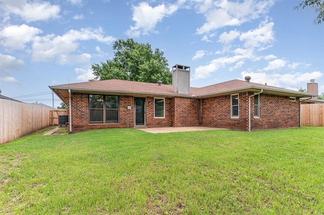 2232 Butternut Pl, Edmond, OK 73013 - rear view of property featuring a chimney, a patio, cooling unit, and brick siding