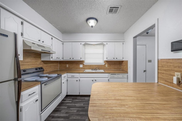 7506 NW Welco Ave, Lawton, OK 73505 - kitchen featuring white appliances, under cabinet range hood, a sink, white cabinets, and dark wood-style floors