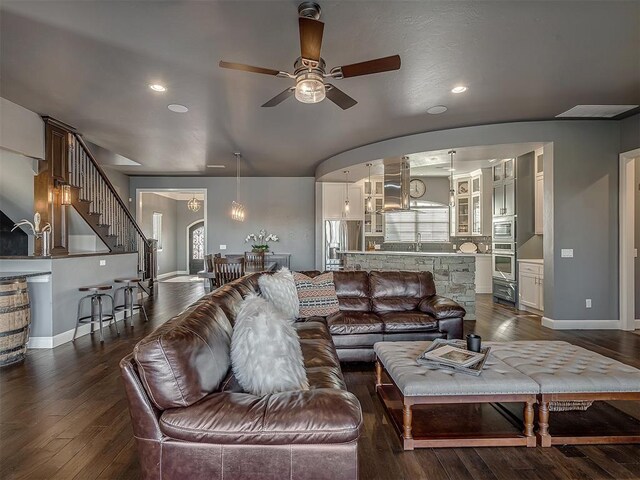 15321 Salem Creek Pl, Edmond, OK 73013 - living area with dark wood-type flooring, a ceiling fan, baseboards, stairs, and recessed lighting