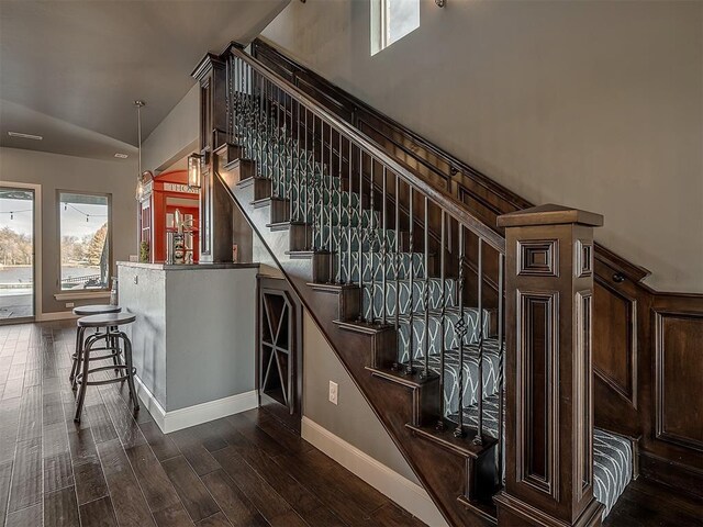 15321 Salem Creek Pl, Edmond, OK 73013 - staircase with plenty of natural light, wood finished floors, vaulted ceiling, and baseboards