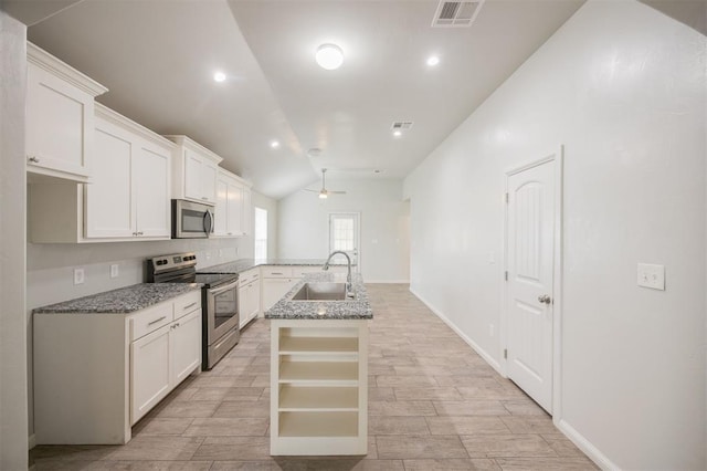6100 SE 7th St, Midwest City, OK 73110 - kitchen with stainless steel appliances, a sink, lofted ceiling, open shelves, and ceiling fan