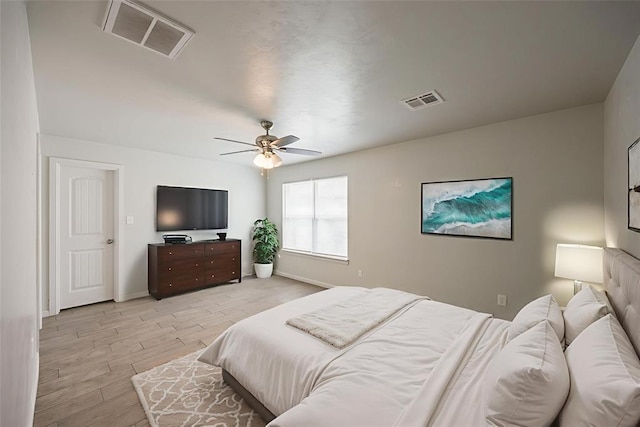 6100 SE 7th St, Midwest City, OK 73110 - bedroom featuring light wood-style floors, baseboards, and ceiling fan