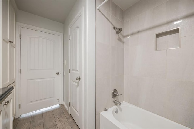 6100 SE 7th St, Midwest City, OK 73110 - bathroom featuring shower / tub combination, vanity, and wood finished floors