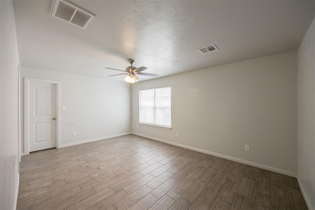 6100 SE 7th St, Midwest City, OK 73110 - spare room featuring ceiling fan, wood finished floors, and baseboards