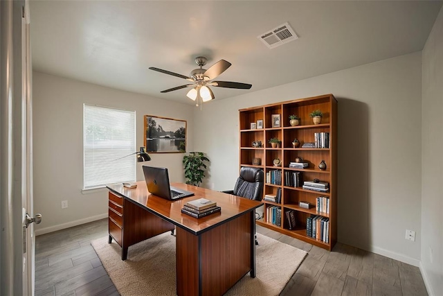 6100 SE 7th St, Midwest City, OK 73110 - office space with a ceiling fan, light wood-type flooring, and baseboards