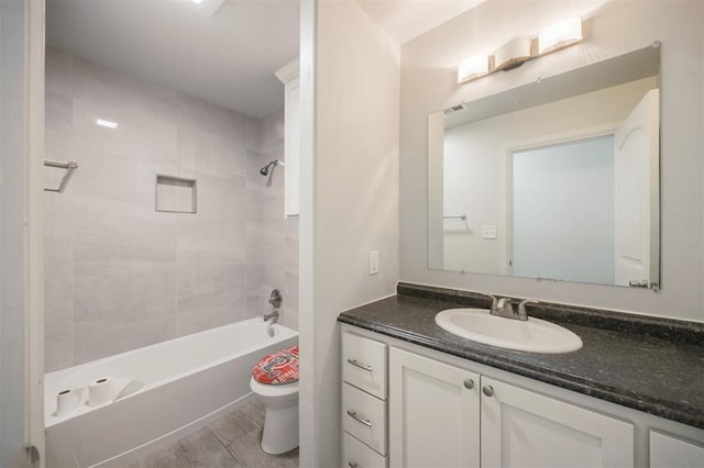 6100 SE 7th St, Midwest City, OK 73110 - full bathroom with vanity, toilet, and shower / washtub combination