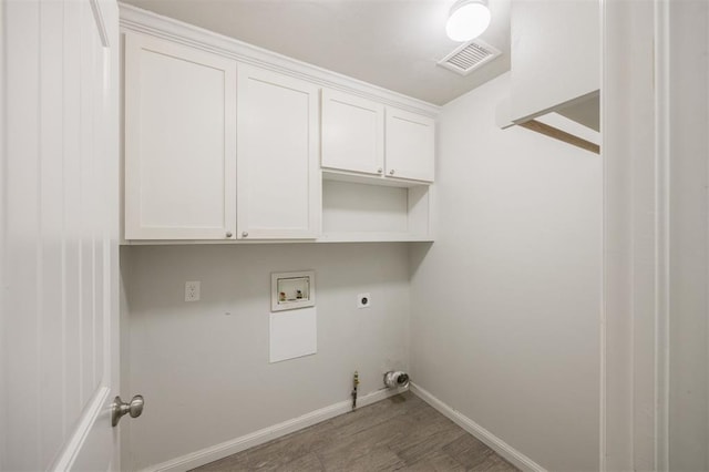 6100 SE 7th St, Midwest City, OK 73110 - laundry room featuring electric dryer hookup, wood finished floors, washer hookup, hookup for a gas dryer, and baseboards