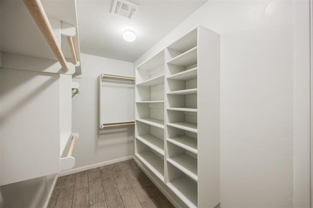 6100 SE 7th St, Midwest City, OK 73110 - spacious closet featuring wood finished floors