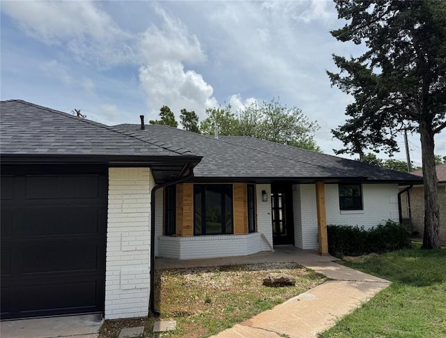 106 Briarwood Crossroads, Moore, OK 73160 - ranch-style house with brick siding, a shingled roof, a garage, and covered porch